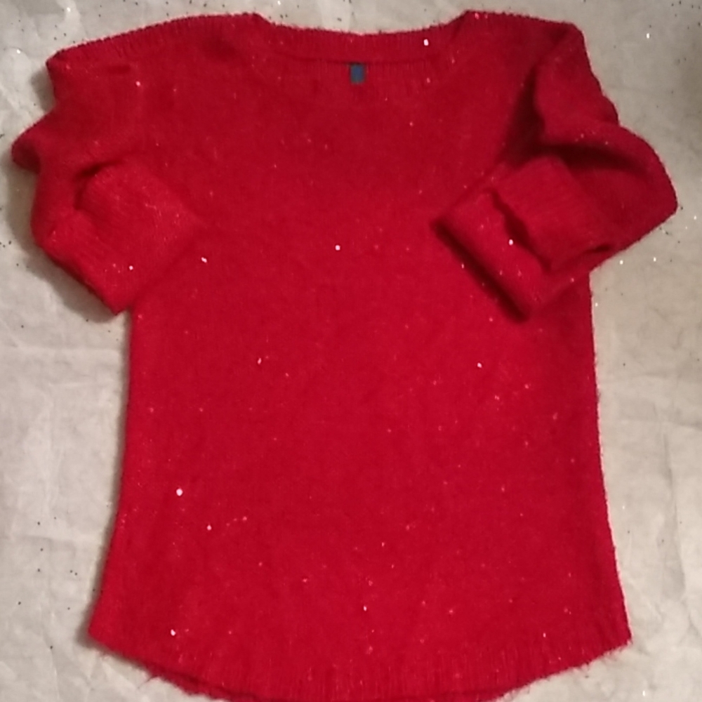 Red sweater with red sequence.